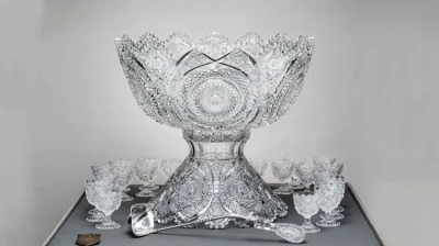 Libbey Glass Company (American 1892-1919), Punch Bowl and stand with 23 cups, thick colorless glass, overall: 21 1/2 x 23 7/8 x 23 7/8 in. (54.6 x 60.6 x 60.6 cm), Toledo Museum of Art (Toledo, Ohio), Gift of Libbey Glass Company, division of Owens-Illinois Glass Company, 1946.27A-Y