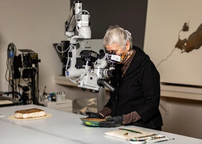 Woman looking into scope
