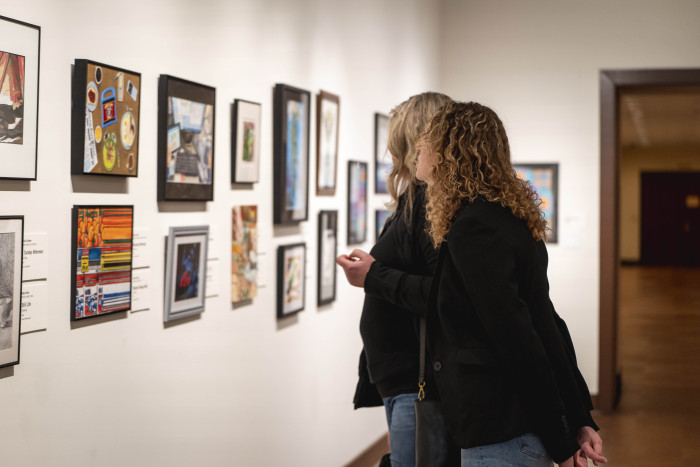 People looking at artwork