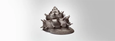 Helmet in the form of a Sea Conch Shell, 1618, Nagasone Tojiro Mitsumasa (Japanese, 1600s), iron with traces of lacquer and textiles, Worcester Art Museum, The John Woodman Higgins Armory Collection, 2014.89.1